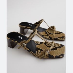 Double strap leather heeled sandals.